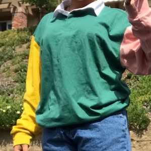 A long sleeve multi color polo tee.